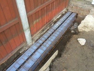 Foundations: Trench footings dug and reinforced, ready for concrete.