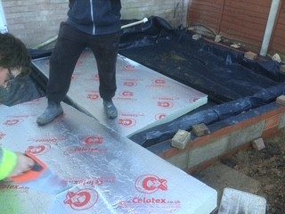 Floor insulation: Membrane laid and rigid insulation boards fitted before the slab.