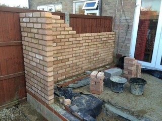 Facing brickwork: Brickwork matched to the house and laid to the line.