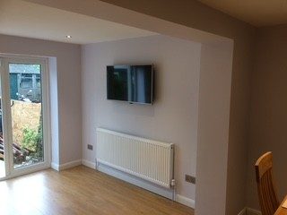 Ready to live in: Walls plastered, radiators hung, flooring down.